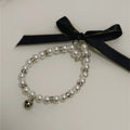 Collier Perles avec Grelot Doré et Ruban Noir pour Chien et Chat